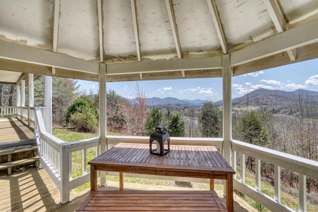 wooden deck featuring a gazebo and a mountain view