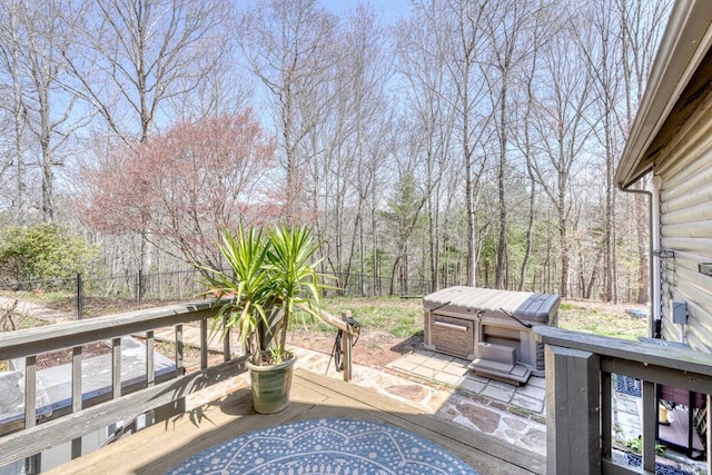 wooden deck featuring a hot tub