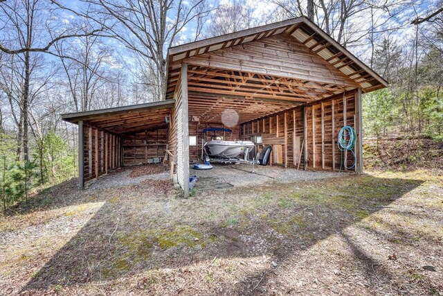 view of vehicle parking featuring a carport