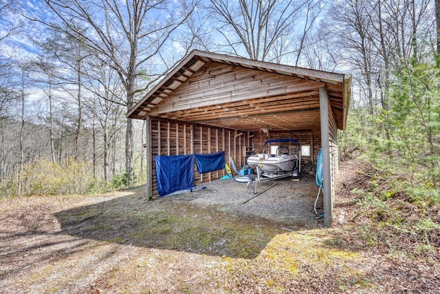 view of outbuilding featuring a carport