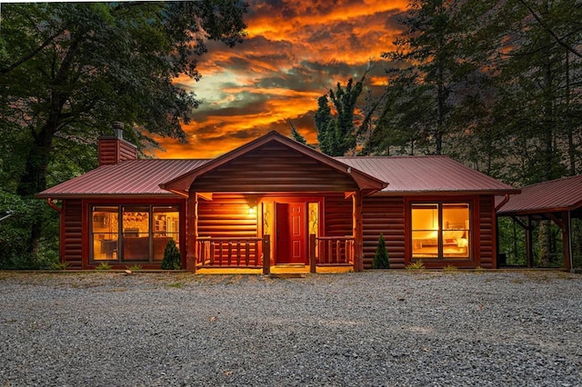 log cabin featuring a porch