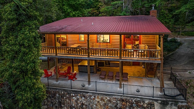 back of property featuring a patio area