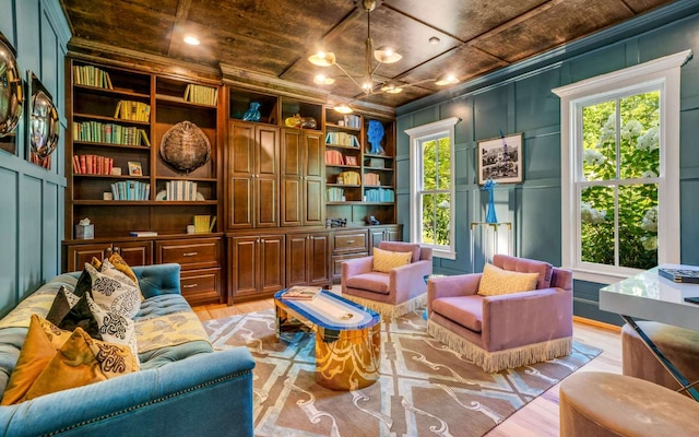 living area featuring built in features, wood ceiling, and light wood-type flooring