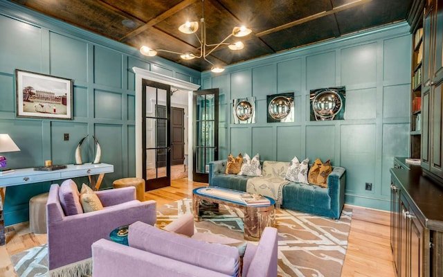 interior space with french doors, an inviting chandelier, wooden ceiling, and light hardwood / wood-style flooring