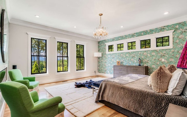 bedroom with crown molding, an inviting chandelier, and light hardwood / wood-style flooring