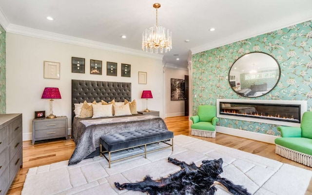 bedroom featuring a notable chandelier, light wood-type flooring, and crown molding