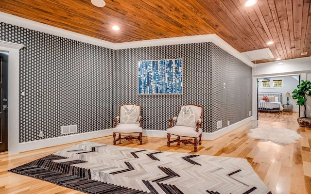 living area with wooden ceiling and light hardwood / wood-style flooring