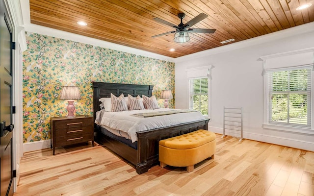 bedroom featuring ceiling fan, light hardwood / wood-style flooring, ornamental molding, and wood ceiling