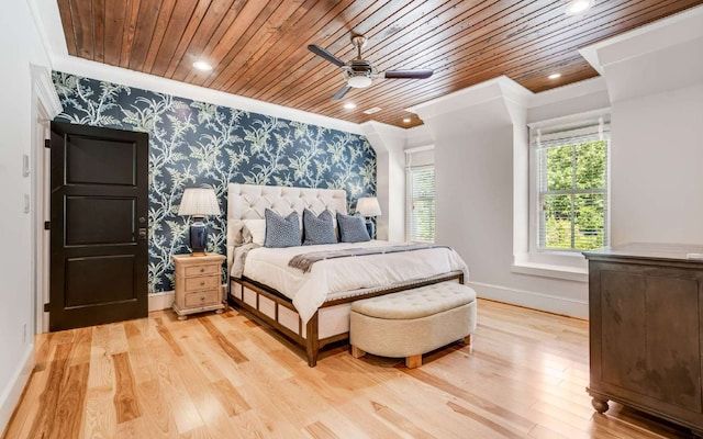 bedroom with light hardwood / wood-style floors, ceiling fan, wood ceiling, and crown molding