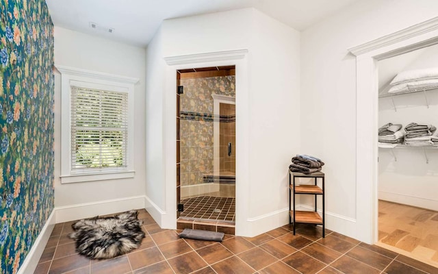 interior space featuring hardwood / wood-style floors and tiled shower