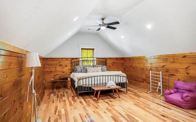 bedroom with lofted ceiling, ceiling fan, and light hardwood / wood-style floors