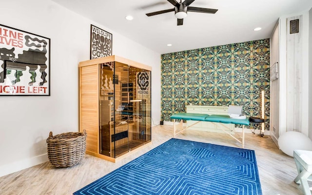 interior space featuring light hardwood / wood-style floors and ceiling fan