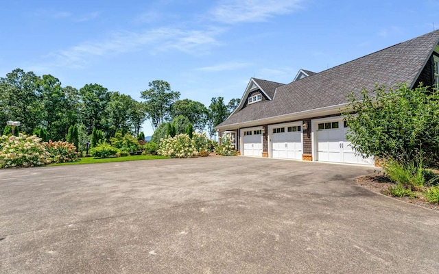 view of side of home with a garage