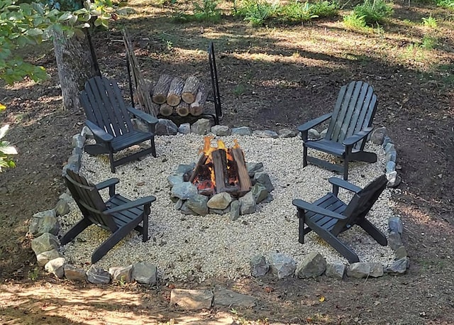 view of property's community featuring a fire pit