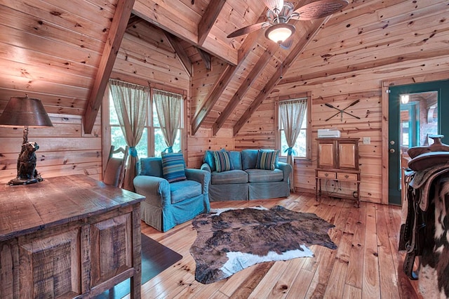 living area featuring wooden ceiling, light wood finished floors, and wooden walls