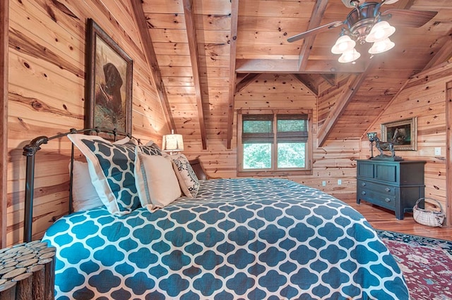 bedroom with wood ceiling, vaulted ceiling with beams, wooden walls, and wood finished floors