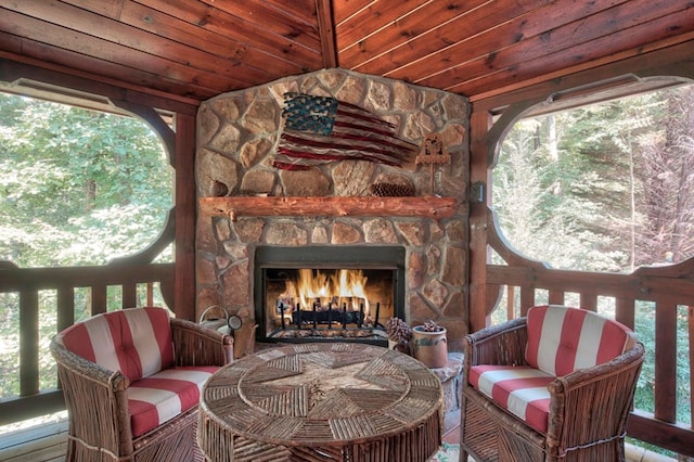 wooden deck with a fireplace