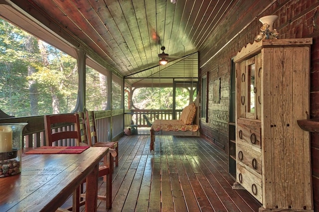 sunroom / solarium with lofted ceiling and wooden ceiling