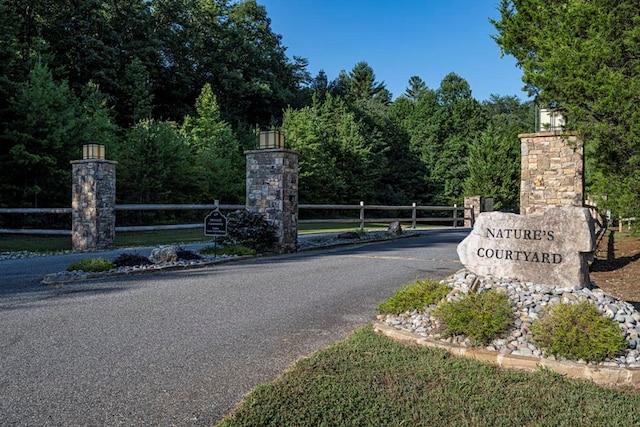 community sign with fence