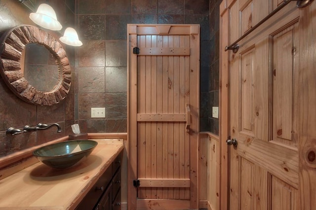 bathroom with backsplash and vanity