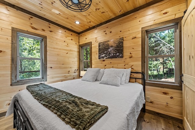 bedroom featuring wooden ceiling and hardwood / wood-style floors