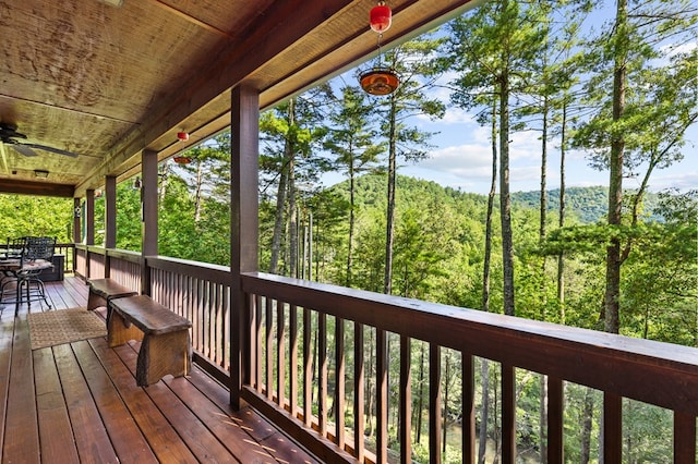 wooden terrace featuring ceiling fan