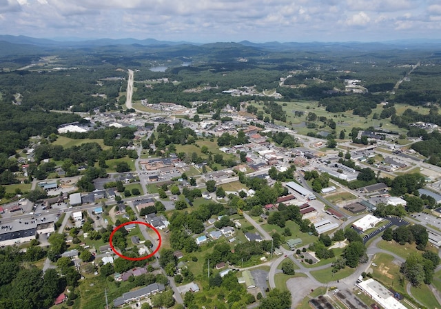 birds eye view of property with a mountain view