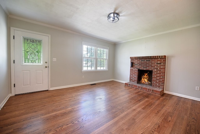 unfurnished living room featuring dark hardwood / wood-style flooring, a fireplace, and ornamental molding