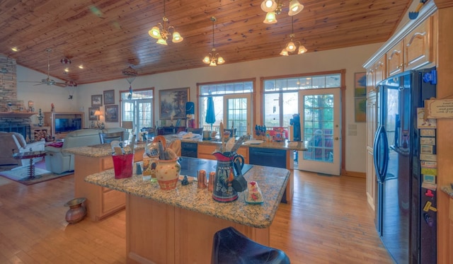 641/638 Timberwood Hills Rd, Murphy, NC 28906 - kitchen featuring a wealth of natural light, a kitchen island, and black appliances