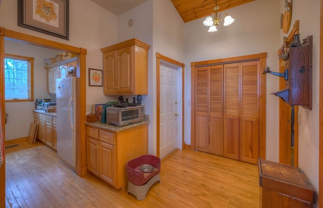 641/638 Timberwood Hills Rd, Murphy, NC 28906 - kitchen featuring freestanding refrigerator, light wood-style flooring, a toaster, and high vaulted ceiling