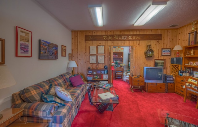 641/638 Timberwood Hills Rd, Murphy, NC 28906 - carpeted living room with a textured ceiling, wooden walls, and visible vents