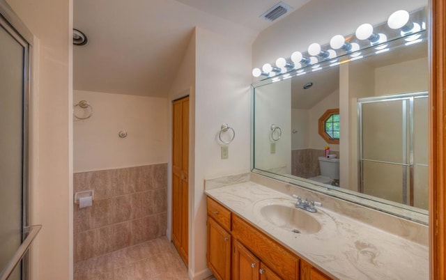 641/638 Timberwood Hills Rd, Murphy, NC 28906 - bathroom featuring lofted ceiling, toilet, vanity, visible vents, and tile patterned floors