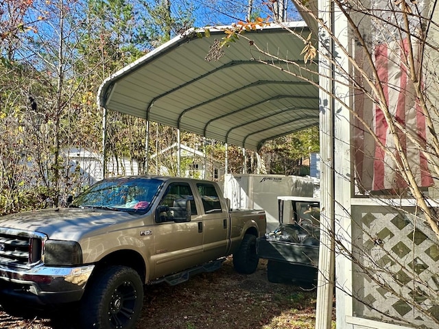 view of vehicle parking with a carport