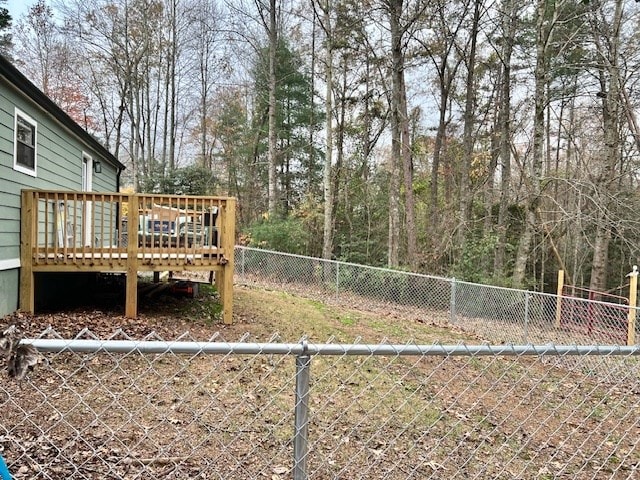 view of yard featuring a wooden deck