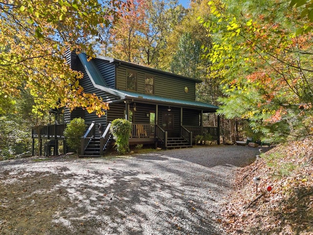 log cabin with a porch