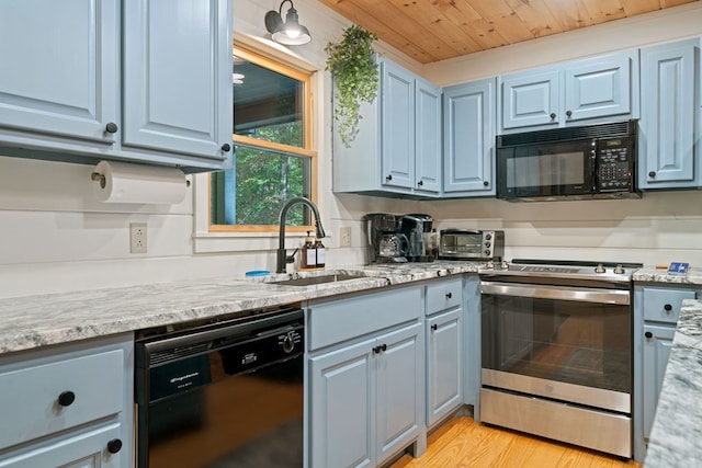 kitchen with light stone countertops, wood ceiling, sink, black appliances, and light hardwood / wood-style floors