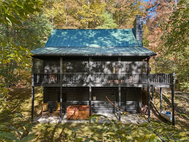 back of house with a patio and a wooden deck