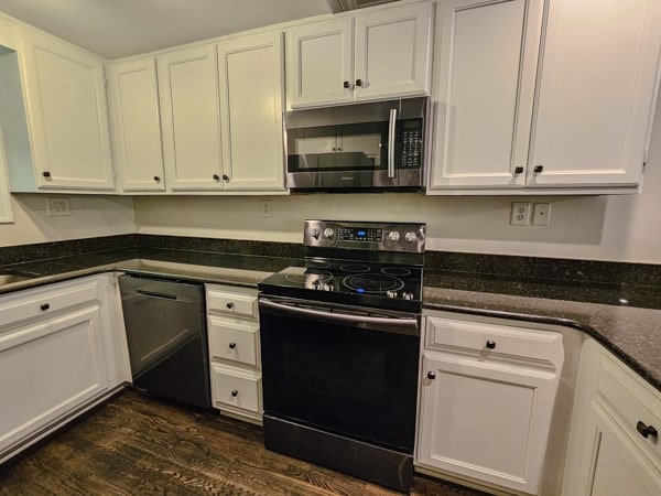 kitchen featuring electric range, white cabinetry, stainless steel microwave, dark wood-type flooring, and dishwashing machine