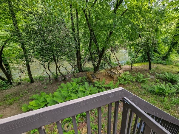 view of yard with a balcony