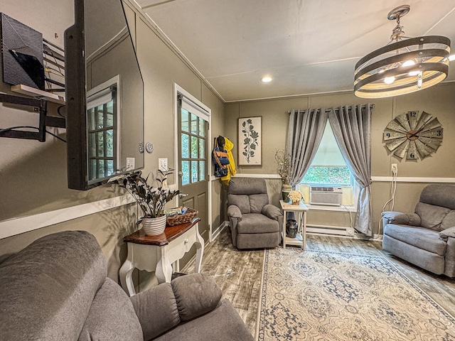 390 Pinebark Ln, Murphy, NC 28906 - living area featuring a baseboard radiator, wood finished floors, healthy amount of natural light, cooling unit, and ornamental molding