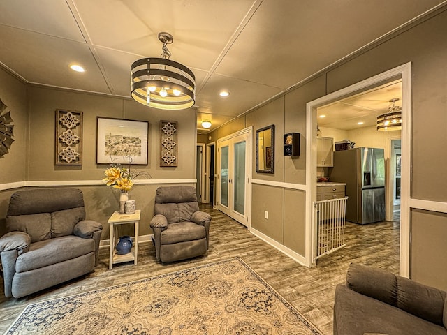 390 Pinebark Ln, Murphy, NC 28906 - living room featuring a decorative wall, wood finished floors, a chandelier, recessed lighting, and french doors