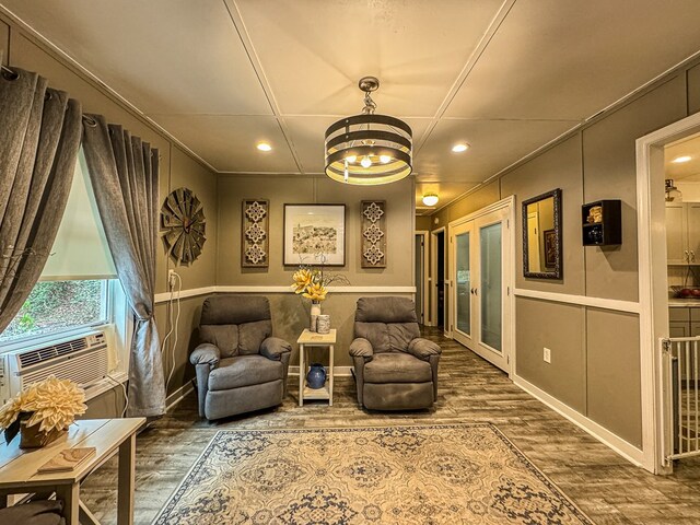 390 Pinebark Ln, Murphy, NC 28906 - living area featuring wood finished floors, a decorative wall, a chandelier, recessed lighting, and ornamental molding
