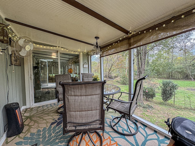 390 Pinebark Ln, Murphy, NC 28906 - sunroom with outdoor dining area, a chandelier, healthy amount of natural light, and beamed ceiling