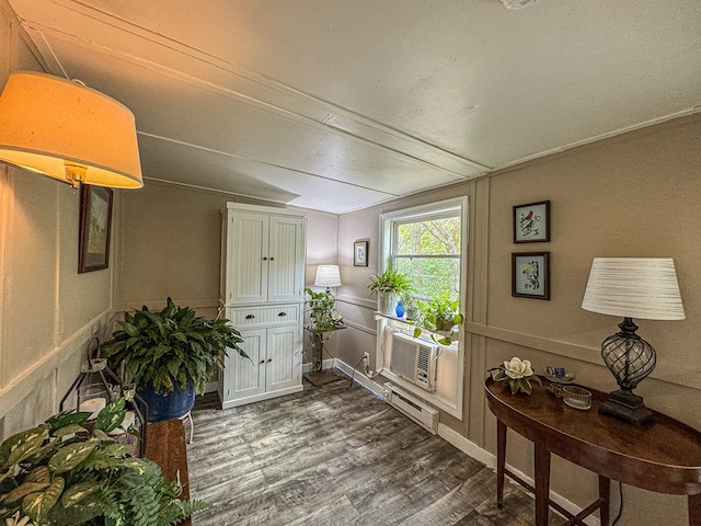 390 Pinebark Ln, Murphy, NC 28906 - doorway featuring dark wood-type flooring, cooling unit, baseboard heating, and a decorative wall