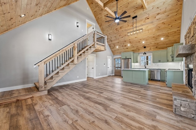 unfurnished living room with wood ceiling, light wood-style flooring, and stairs