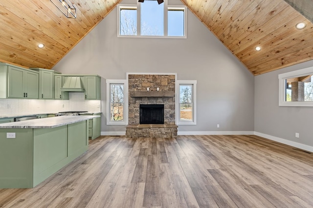 kitchen with light countertops, wooden ceiling, custom range hood, and green cabinets