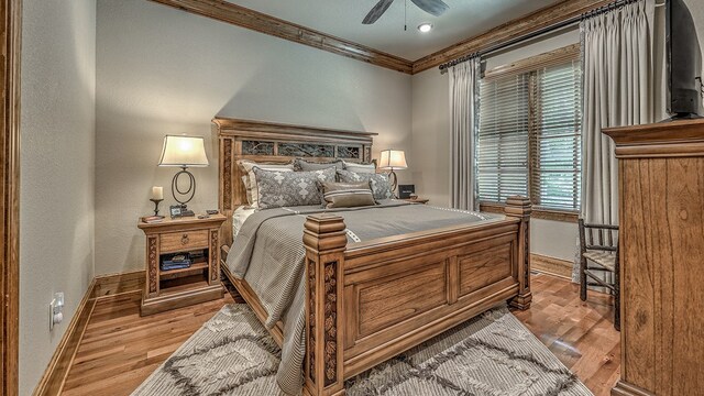 bedroom with ornamental molding and a ceiling fan