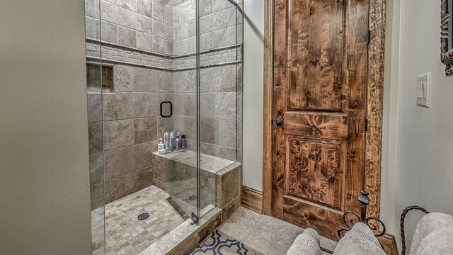 bathroom featuring a shower stall