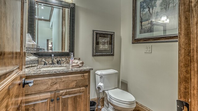 bedroom with an inviting chandelier, crown molding, baseboards, and wood finished floors