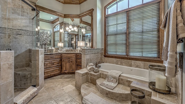 bathroom featuring crown molding, a shower stall, vanity, and a bath